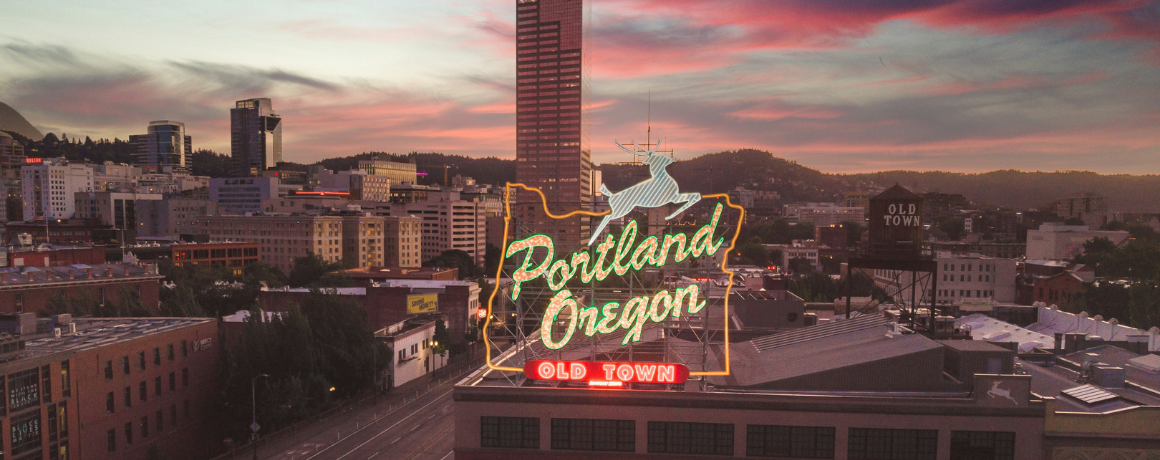 Dwellworks Living Global Corporate Housing Solutions - Portland Oregon sign and city